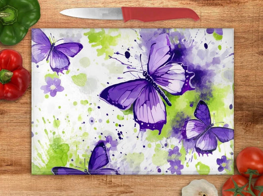 Purple butterflies with green background glass cutting board