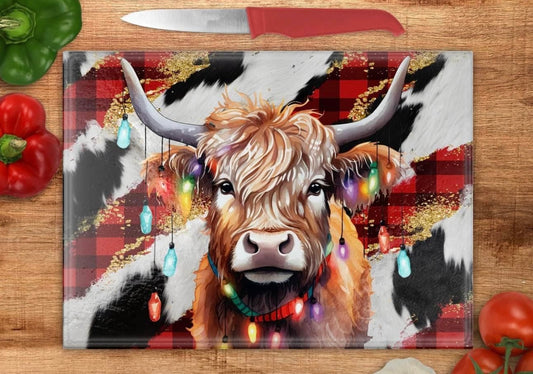 Christmas Highland cow with Christmas lights glass cutting board