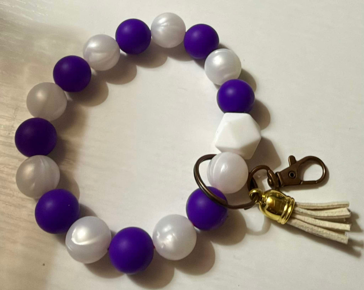 Purple and white wristlet